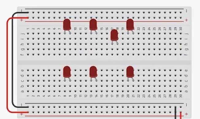 Coloque 7 leds dispostos na forma “ 3 – 1 – 3”.