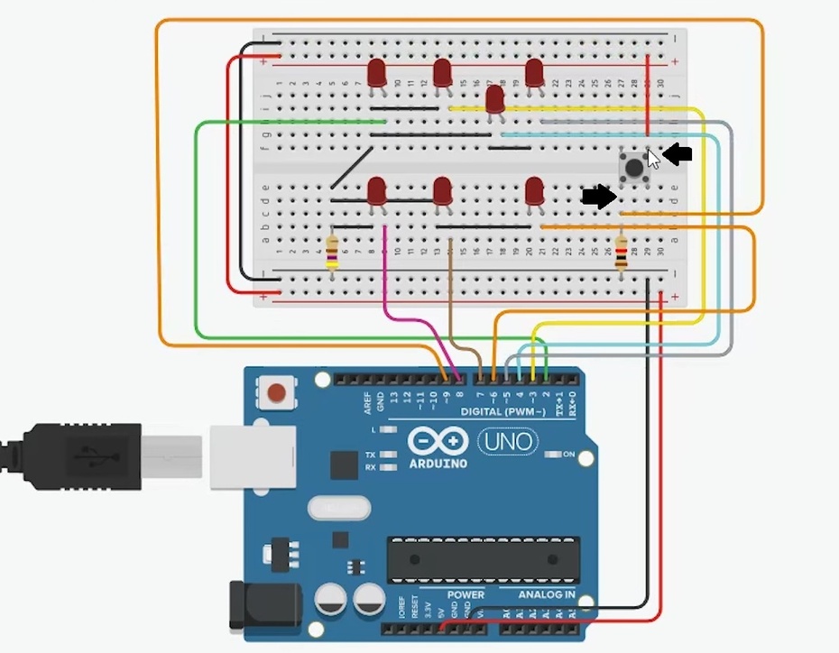 Terminamos as ligações dos terminais positivos, vamos ligar o botão e colocar um resistor de 10k ohms, ligando-o ao terra. Entre o resistor e o terminal do botão, ligado ao resistor, criaremos uma conexão com o pino 9 (digital PWN). Do outro lado do botão, iremos liga-lo ao 5v da placa Arduino.